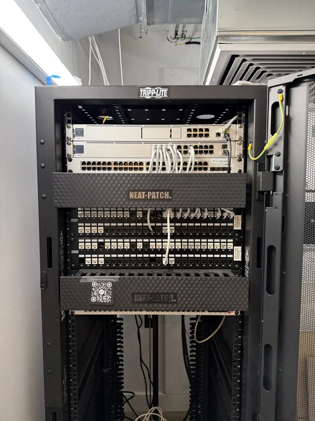 Neat-patched UniFi rack, AI office Wi-Fi near Union Square